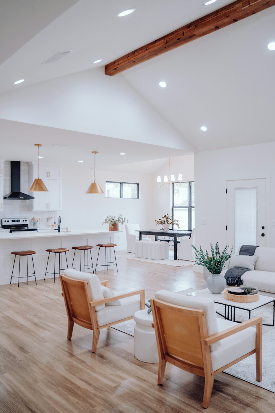Modern open-plan living, dining, and kitchen area in a home.